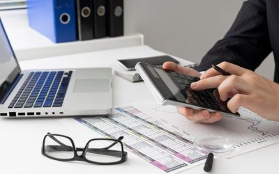 side-view-business-man-calculating-finance-numbers